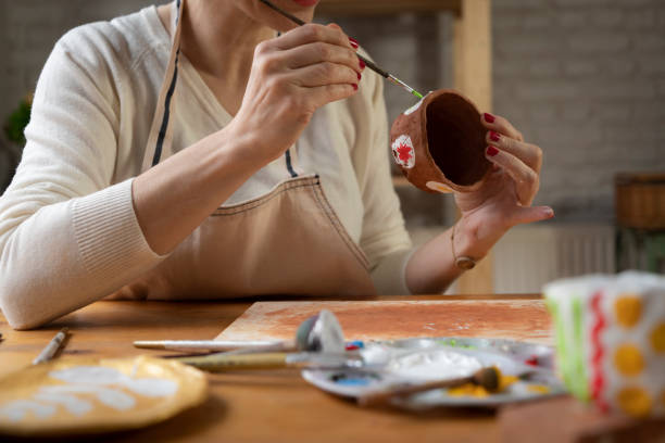 istock Woman painting a pottery 1498879791