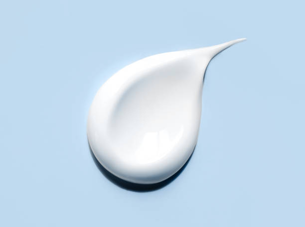 istock cosmetic smears cream texture on blue background 1498880834