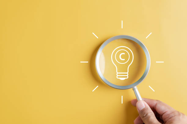 istock Copyright protect idea concept, author rights and patent intellectual property, Copyright icon inside light bulb. 1498881292