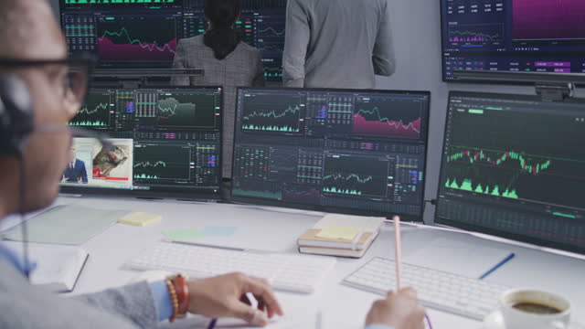 Trader works with displayed real-time stocks