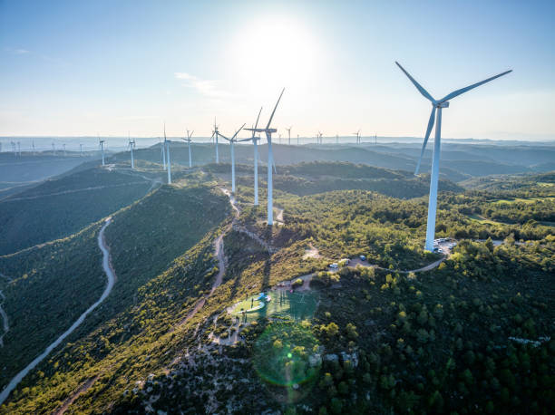 istock paragliders takeoff in front of wind turbines 1498883374