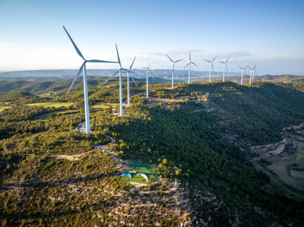 istock paragliders takeoff in front of wind turbines 1498883376