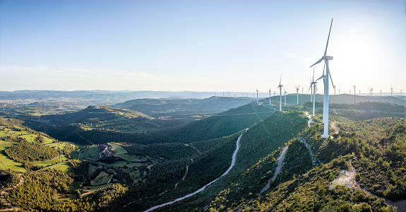 panoramic view of windmills in eolic park over the mountain. Catalonia, Spain
