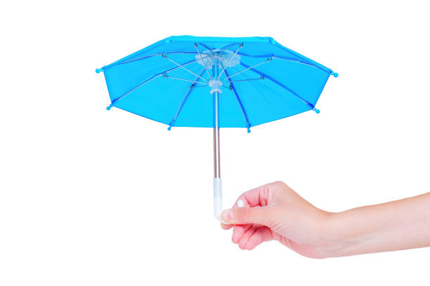 istock Blue Toy Umbrella in Hand on White 1498883699