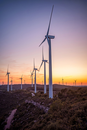 Renewable energy with wind turbines on the mountain at sunset. Maioles, Catalonia, Spain