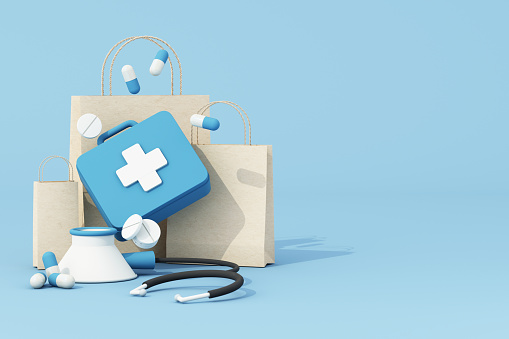first aid kit concept There is a blue pill box surrounded by tablets and capsules, along with a bag of medicine from the hospital. in drug dealing. on blue background. 3d rendering illustration