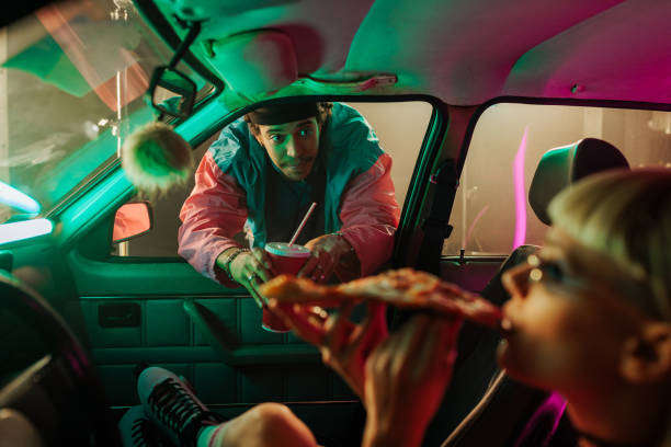 istock Man talking to girl in car. 1498887221