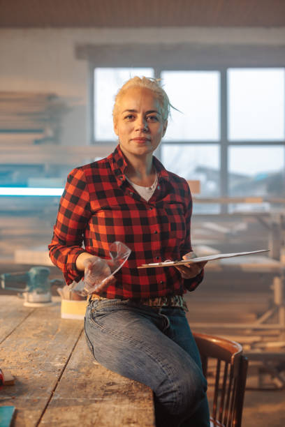 istock Portrait of joyful carpenter in workshop. 1498888435