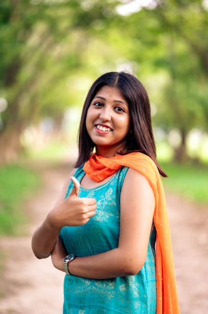 istock Young woman with thumbs up 1498890228