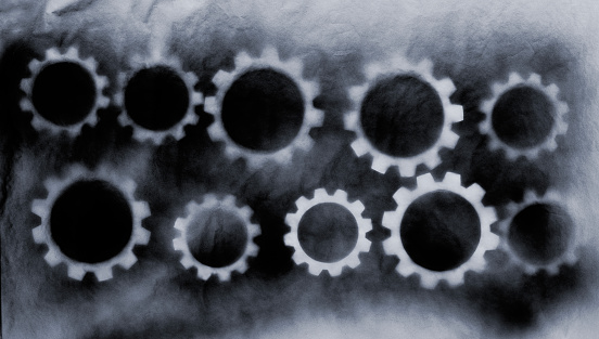 Cogs marks on a spray-painted surface.