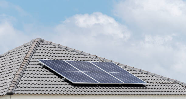 istock Solar cell panel on roof with blue sky and cloud background 1498894389