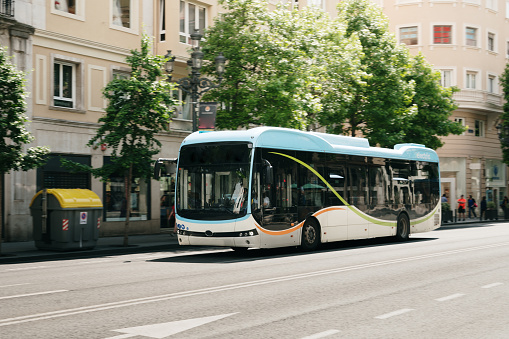 A modern city bus in motion