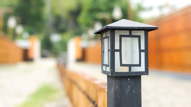 istock Vintage Style Outdoor Light Post at Entrance Gate 1498898440