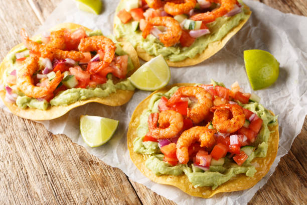 istock Tostadas with shrimps, tomato salsa and guacamole close-up on a table. Horizontal 1498900169