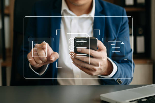 istock E-document management Paperless workplace, e-signing, electronic signature, document management. businessman signs an electronic document on a virtual notebook screen using a stylus pencil. 1498900508