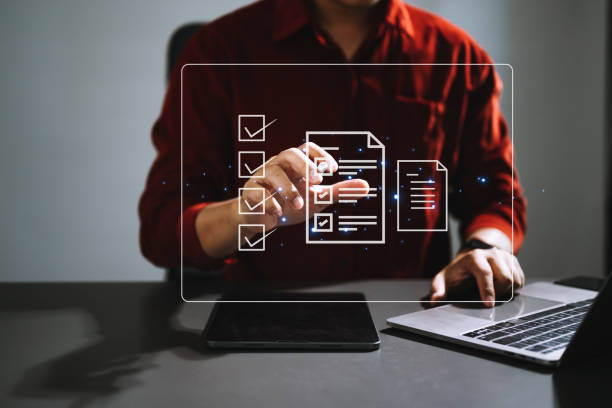istock Checklist and filling survey form online. Document management system, DMS. Assessment form, questionnaire, checklist .Quality control and accuracy Check completeness.using a laptop and tablet 1498900522