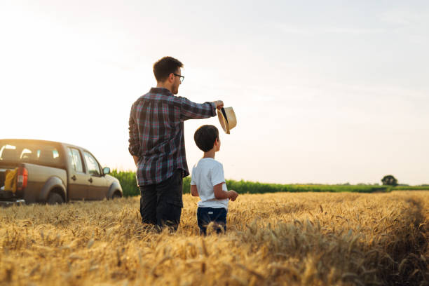 istock father and son outdoor at field 1498903488