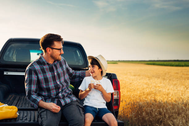 istock father and son outdoor at field 1498903491