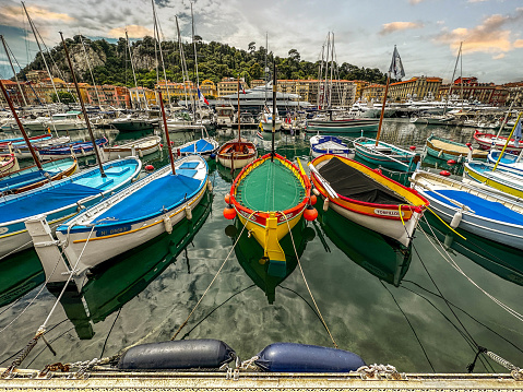 Boats lined up and secured inside the marina of the Port of Nice, Cote d'Azur, France.