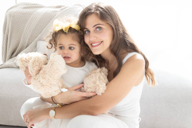 istock Happy Mother Hugging Her Two Year Old Daughter 1498905961