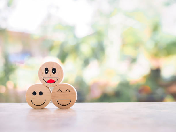 istock Emotion face wooden block. Customer service rating experience, feedback emotion and satisfaction survey. 1498906054