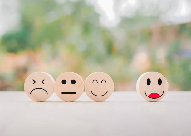 istock Emotion face wooden block. Customer service rating experience, feedback emotion and satisfaction survey. 1498906521