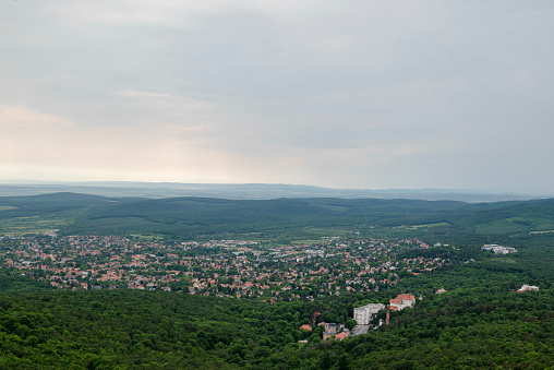 View from Béka-Tó, a nature preserve in Budapest on a cloudy day. Budapest is surrounded by a lot of wooded areas covering Buda Mountains.