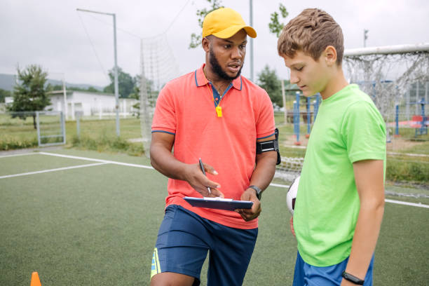 istock Boy having individual soccer training by the black coach 1498912868
