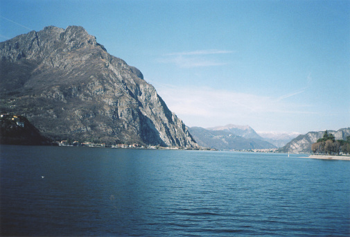 Lecco Lake View with Mountains in Background. Sunny Spring Day in Italy. Film Photography