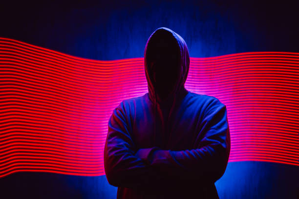 istock Scary Faceless Man In A Hoodie Under Neon Lights 1498924982