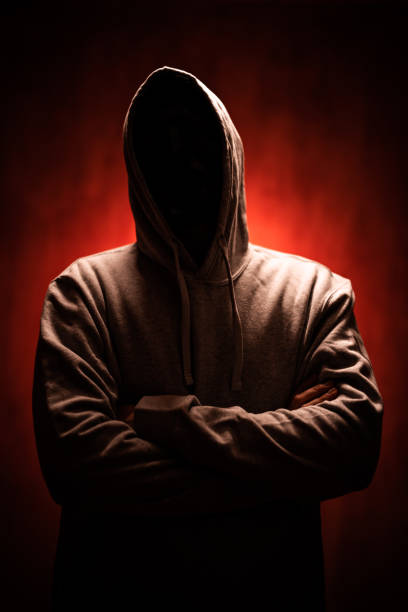 istock Scary Faceless Man In A Hoodie Under Neon Lights 1498925542