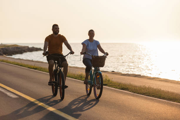 istock Couple enjoying a cycle ride along the seacoast 1498927648