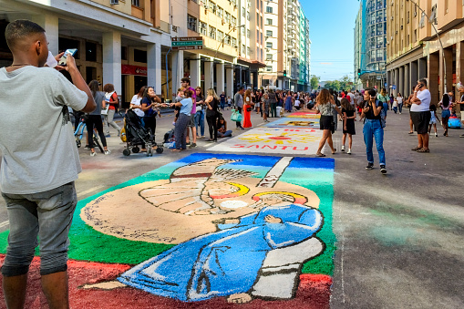 Niteroi, Rio de Janeiro, Brazil - June 8, 2023: Street scene of the Sao Goncalo Annual Festival Of Sand Carpets. The religious event is a tradition and a tourist attraction.