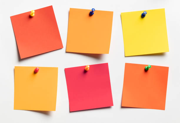 istock Group of autumn colors Sticky notes on white paper background 1498928877