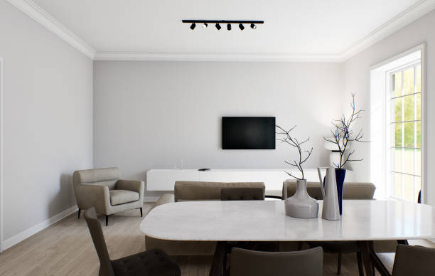 istock The interior of a light minimalist kitchen-studio. Interior with dining area and seating area with sofa and TV. 3D rendering 1498930467