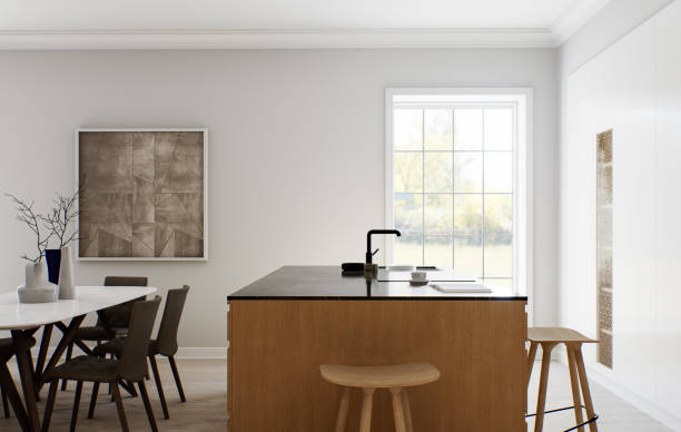 istock The interior of a light minimalist kitchen-studio with a wooden island. Kitchen with bar stool and black marble top with large window and appliances. Black faucet and stove on the island. 3D rendering 1498930473