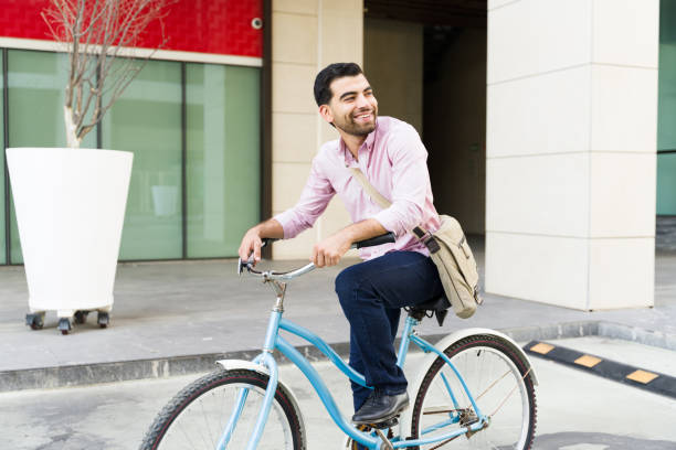 istock Handsome man on a bike ride commuting to his work building 1498930553