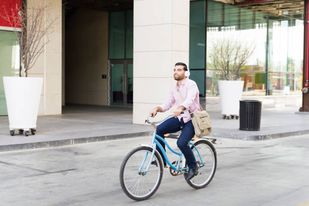 istock Excited man enjoying his work commute riding a bike 1498930977