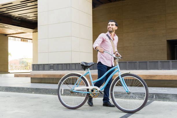 istock Happy man outdoors smiling on his bike commute 1498932591