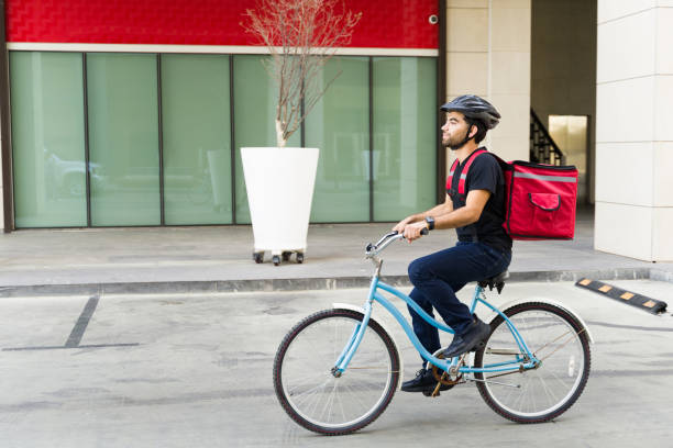 istock Delivery worker riding his bike making errands and delivery service 1498933139