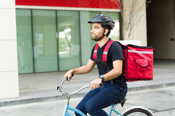 istock Handsome man with a backpack working in the delivery service 1498933155