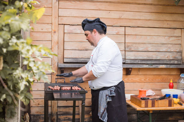 istock Chef checking if the barbecue is hot or not 1498933303