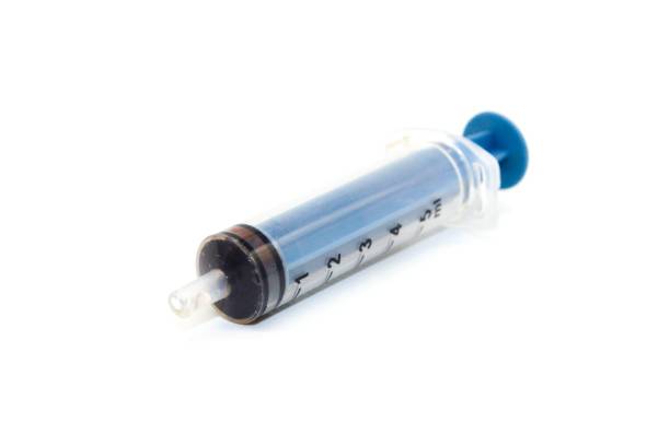 istock Blue plastic medical syringe isolated on a white background 1498937643