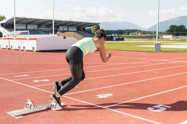 istock Woman preparing for the run race, using starting block 1498937749