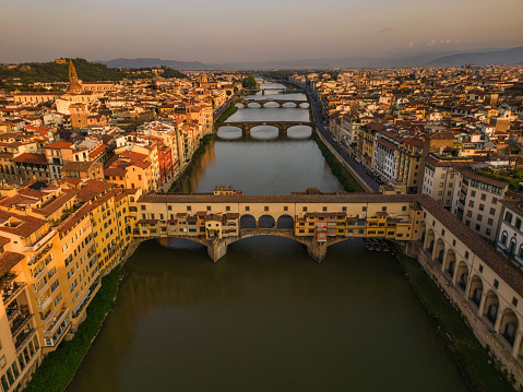 Aerial view of the river Arno, Ponte Vecchio and Florence at sunrise Italy