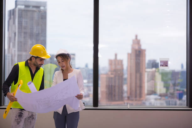 istock A male Middle East engineer consulting with female architecture with construction plan inside the building. 1498938156