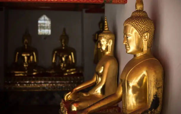 Photo of Buddha statues at Wat Po (Wat Pho), Temple of Reclining Buddha popular tourist attraction in Bangkok , Thailand