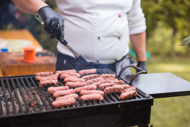 istock Cook using meat tweezers when grilling meat 1498939391