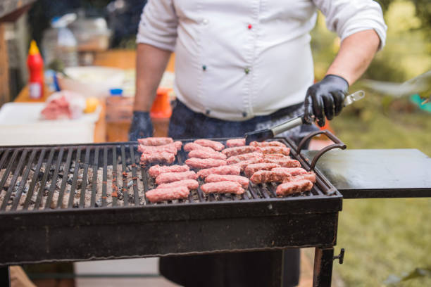 istock Cook using meat tweezers when grilling meat 1498939408
