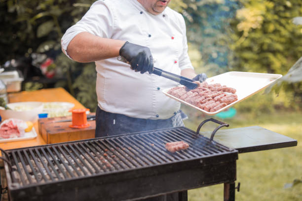 istock Cook using meat tweezers when grilling meat 1498939653